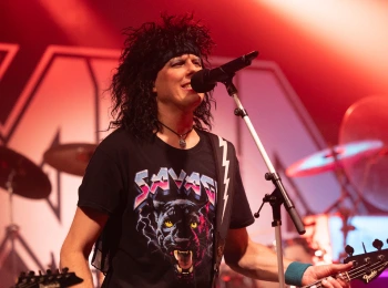 a man singing into a microphone