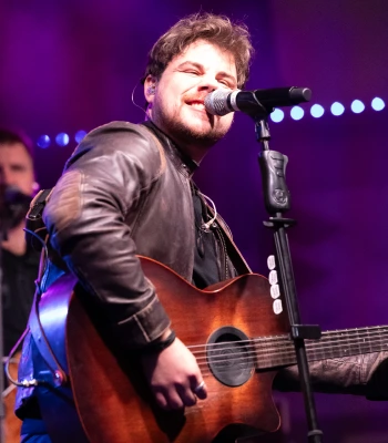 a man singing into a microphone