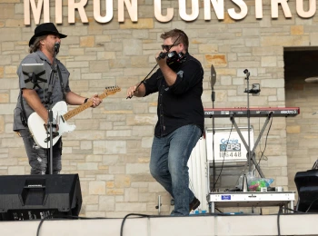 a group of men playing instruments on stage