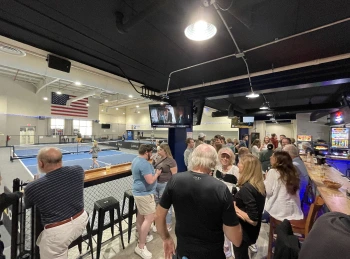 a group of people standing in a room