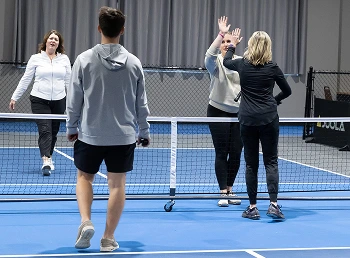 pickleball players on a pickleball court